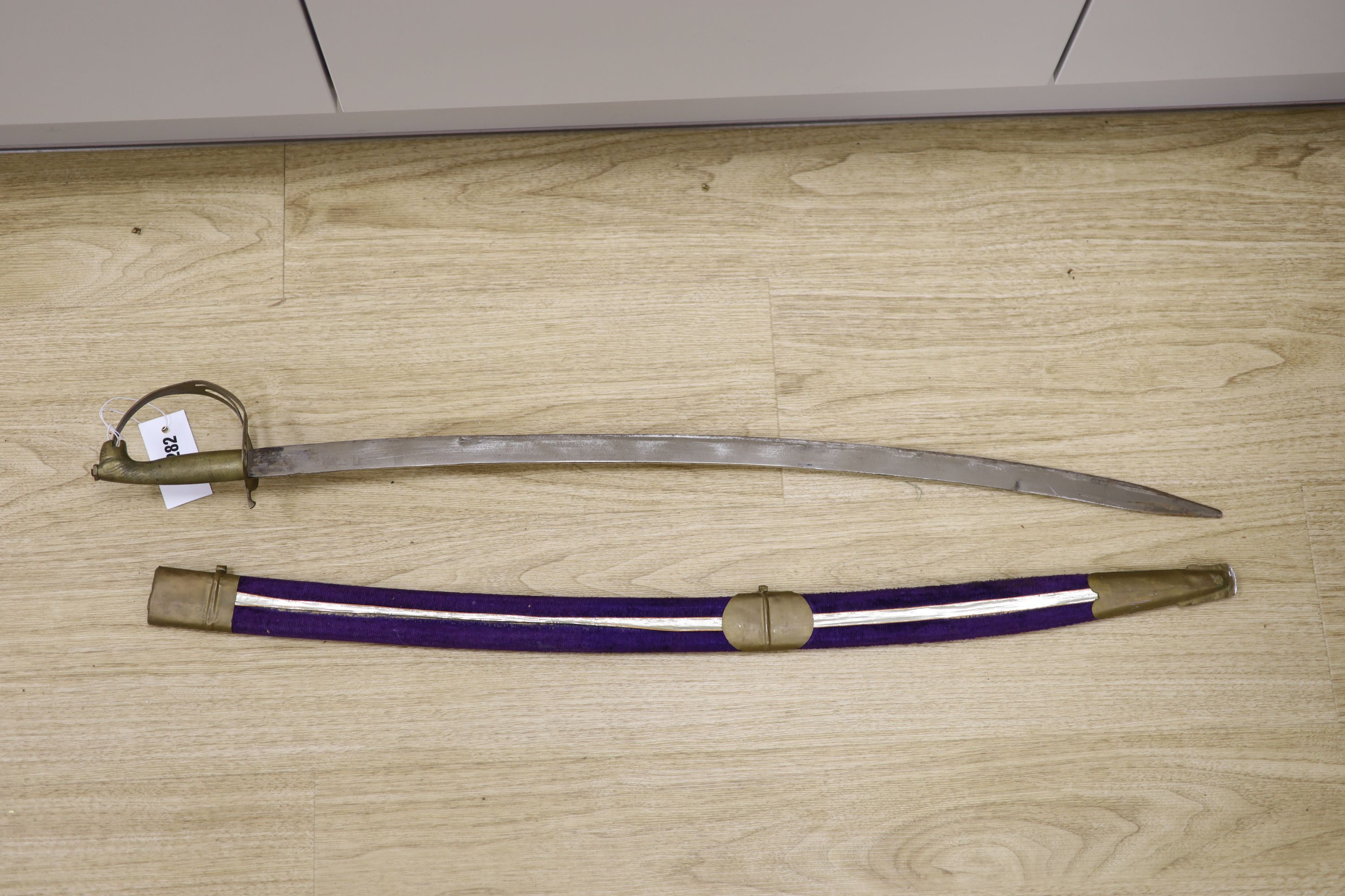 A 20th century Indian sabre with velvet scabbard, length 90cm